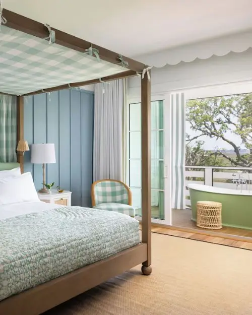 One of the beautifully designed rooms at the Dublin hotel by Auberge, with a jacuzzi tub on the balcony